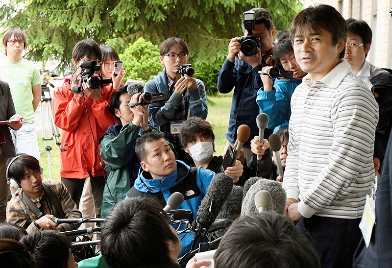 Takayuki Tanooka (R), father of 7-year-old boy Yamato Tanooka who went missing on May 28, 2016 after being left behind by his parents, was found alive, speaks to the media in Hakodate (Reuters Photo