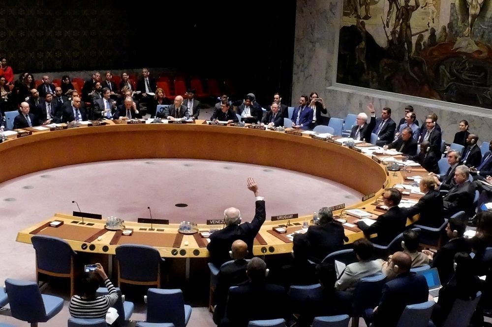 Russia Ambassador Vitaly Churkin and Venezuelan Ambassador Rafael Ramirez vetoes a draft resolution at the U.N. Headquarters in New York, U.S., Oct. 8.