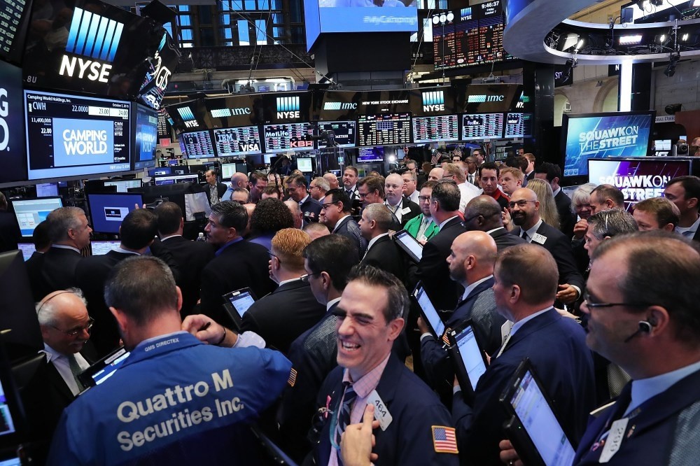 Traders work on the floor of the New York Stock Exchange. Disappointing growth in the worldu2019s largest economy might make it less likely the U.S. Federal Reserve to raise interest rates in December.