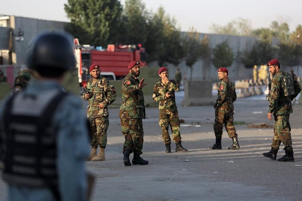 Afghan soldiers and police inspects the site of suicide attack In Kabul near Afghanistan's Defense Ministry, Monday, Sept. 5, 2016. (AP Photo)