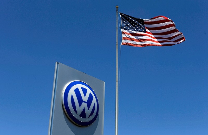 A U.S. flag flutters in the wind above a Volkswagen dealership in Carlsbad, California, U.S. May 2, 2016. (Reuters Photo)