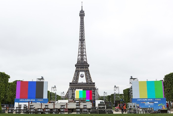The Euro 2016 Paris Fan Zone is under construction on the Champs de Mars, with a giant screen and the Eiffel Tower on the background, in Paris, France, Friday, June 3, 2016. (AP Photo)