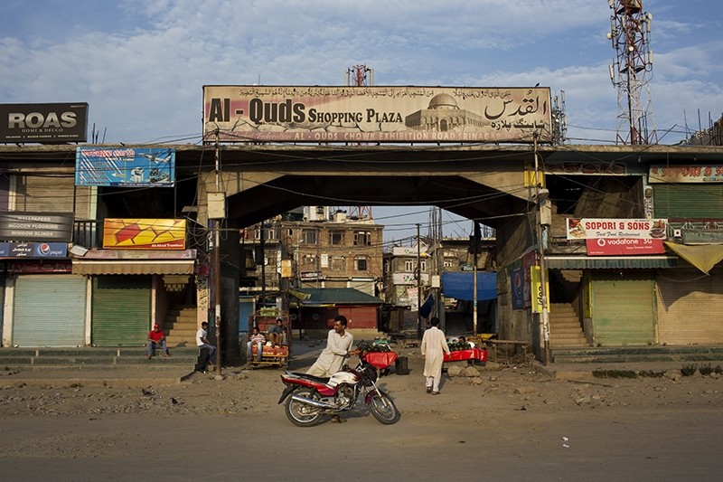 In this July 25, 2016, photo, Kashmiri fruit vendors wait for customers at a closed market during a strike in Srinagar, India-controlled Kashmir. (AP Photo)