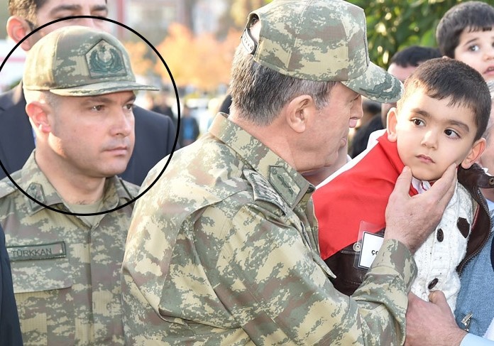 In this file photo, Lt. Cl. Levent Tu00fcrkkan is pictured beside Turkey's Chief of Staff Hulusi Akar 