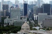 The Parliament Building (bottom) is seen in front of office buildings of government ministeries in Tokyo, Japan July 19, 2016. (Reuters Photo)