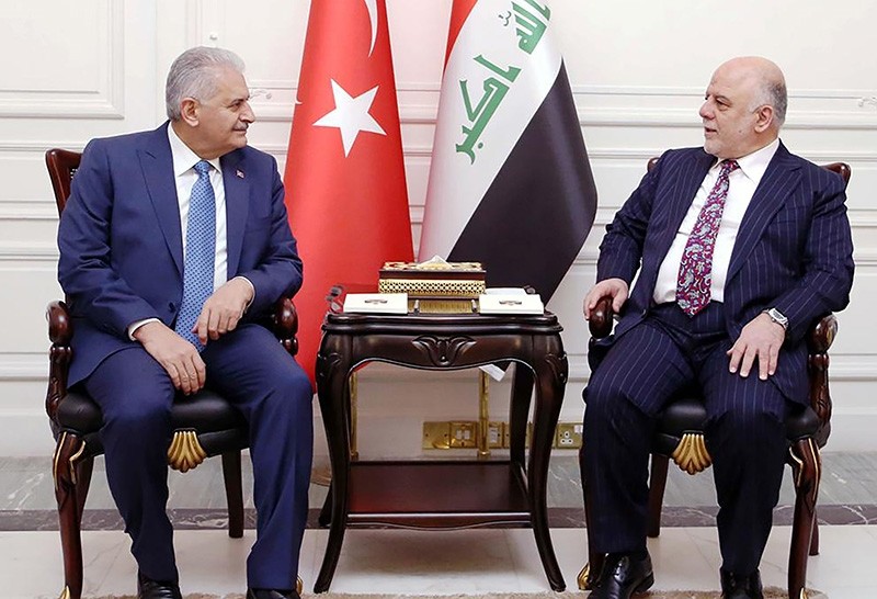 A handout picture released by the Iraq Prime Minister's Press Office on January 7, 2017, shows Iraqi Prime Minister Haidar al-Abadi (R) meeting with his Turkish counterpart Binali Yu0131ldu0131ru0131m in the capital Baghdad. (AFP Photo)