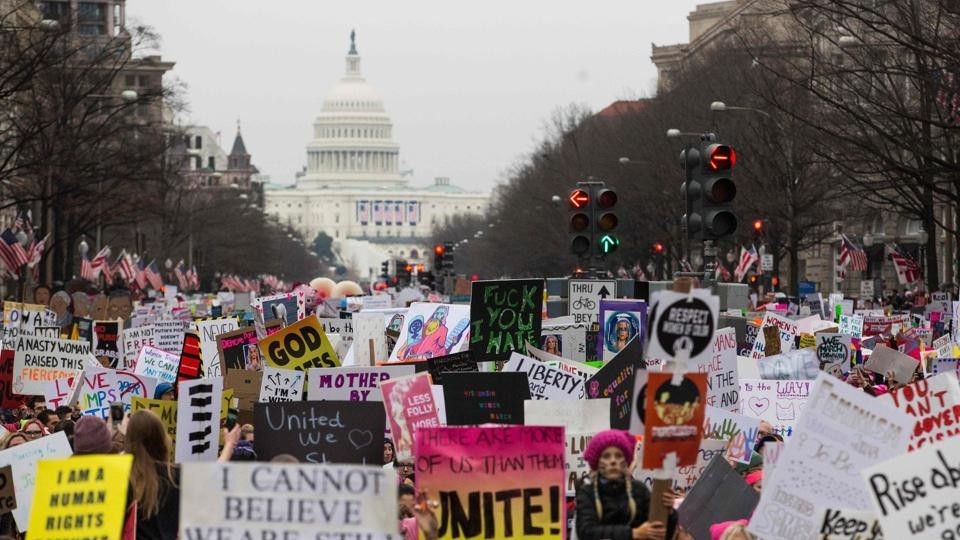 Protesters walk up Pennsylvania Avenue during the Womenu2019s March in Washington. 