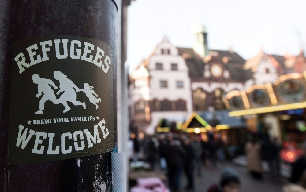 A sticker reading ,Refugees Welcome, can be seen in the inner city of Freiburg, Germany, Dec. 5. (EPA)