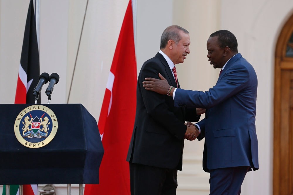 President Erdou011fan (L) shakes hands with Kenyatta at the end of their joint press conference at State House in Nairobi, Kenya. Erdou011fan & Turkish delegation were in Kenya to strengthen diplomatic & economic relations with the East African country.