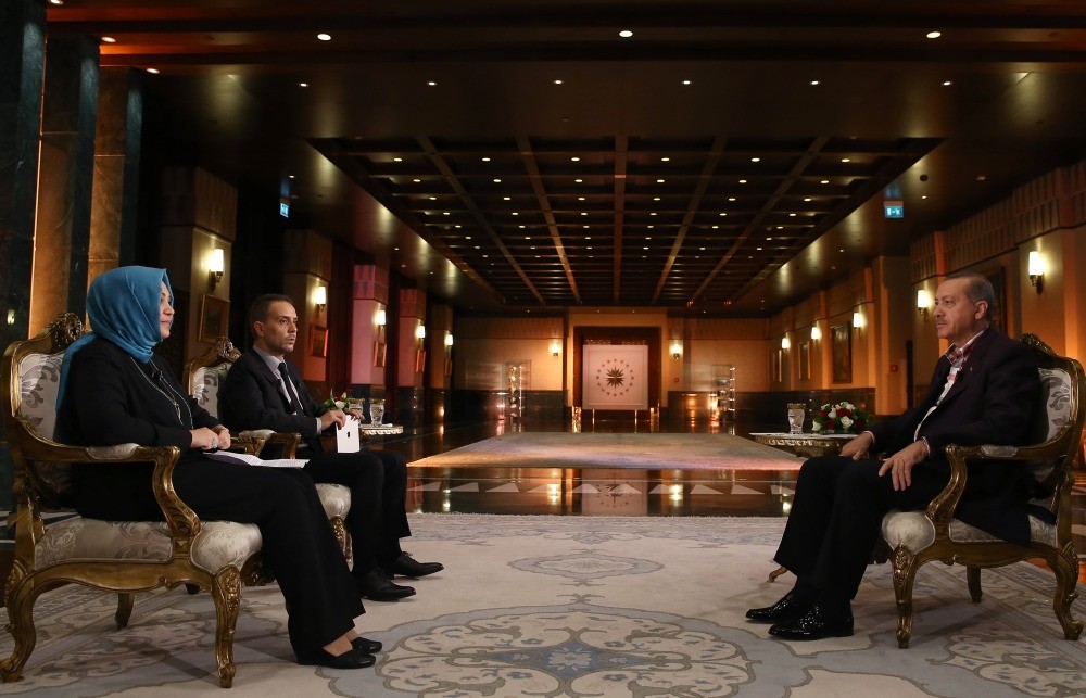 Daily Sabah columnists Hilal Kaplan and Melih Altu0131nok with President Erdou011fan at the Presidential Complex.