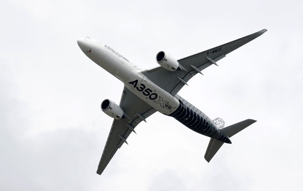 An Airbus A350 jet airliner takes part at the Farnborough Airshow, south west of London, on July 12.