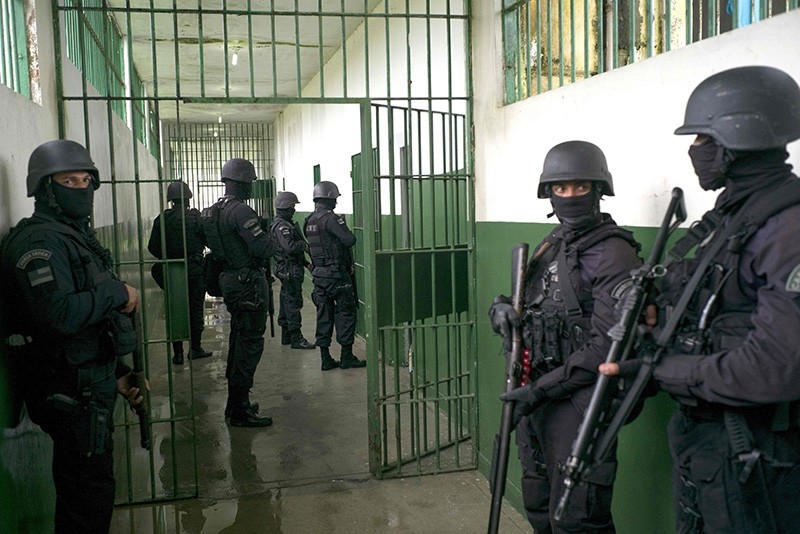 Special Operations Command personnel keep watch during a visit to the Anu00edsio Jobim Penitentiary Complex - where 56 inmates were killed during a riot on two weeks ago, Jan. 14, 2017 in Manaus, Amazonas, Brazil. (AFP Photo)