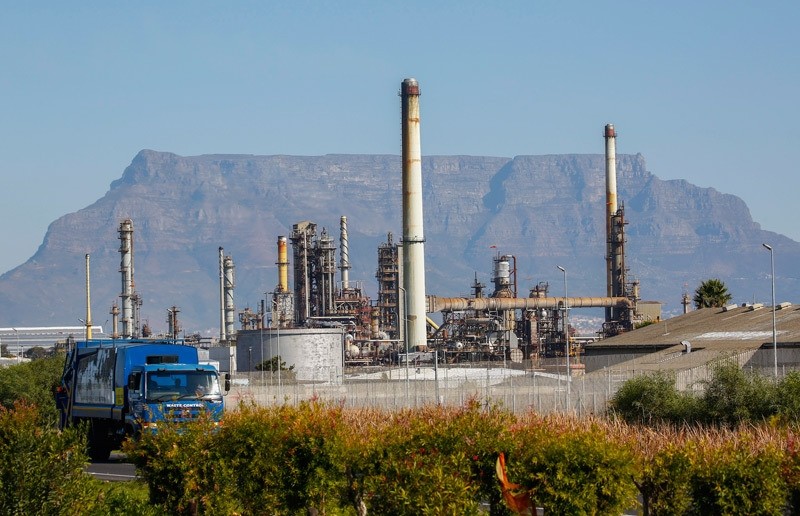A vehicle passes the Chevron Oil Refinery in Cape Town, South Africa (EPA Photo)