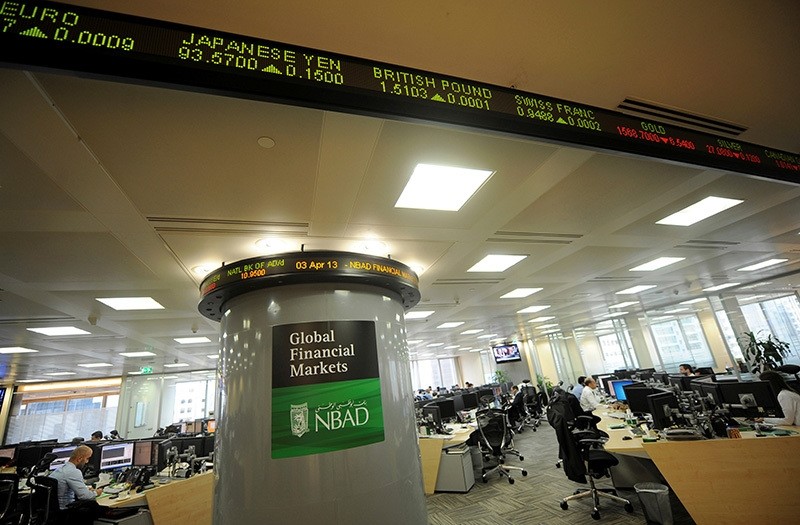 Employees are seen in the offices at the National Bank of Abu Dhabi (NBAD) headquarters. (Reuters Archive Photo)