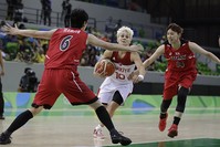 Turkey guard Iu015fu0131l Alben (10) drives to the basket between Japan center Yuka Mamiya (6) and guard Sanae Motokawa during the second half of a women's basketball game at the Youth Center in Rio de Janeiro, Brazil, Tuesday, Aug. 9, 2016. (AP Photo)
