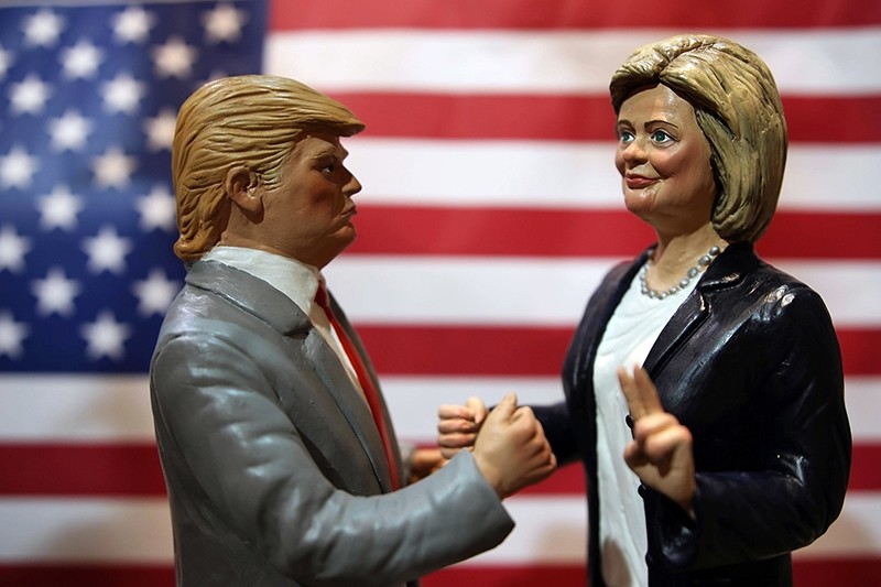 Statuettes depicting the presidential candidates Donald Trump, left, and Hillary Clinton are displayed in a shop in Via San Gregorio Armeno, the street of nativity scene craftsmen, in Naples. (AP Photo)