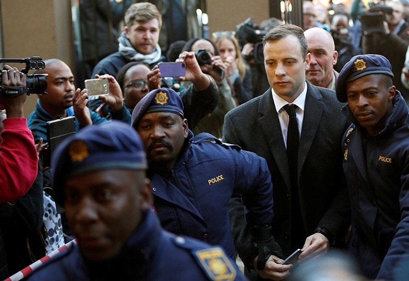 Olympic and Paralympic track star Oscar Pistorius is escorted by police officers as he arrives for his sentencing for the 2013 murder of his girlfriend Reeva Steenkamp, at North Gauteng High Court, Pretoria, S. Africa, July 6, 2016. (Reuters Photo)