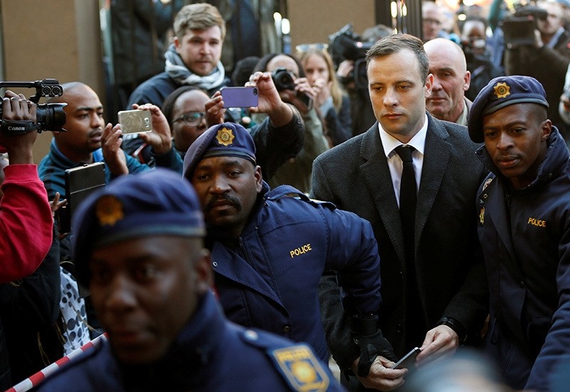 Olympic and Paralympic track star Oscar Pistorius is escorted by police officers as he arrives for his sentencing for the 2013 murder of his girlfriend Reeva Steenkamp, at North Gauteng High Court, Pretoria, S. Africa, July 6, 2016. (Reuters Photo)