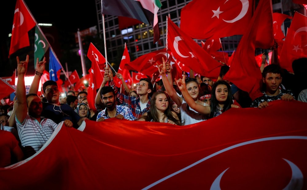 People shouting slogans and waving flags as they gather in solidarity night after night since the July 15 coup attempt in central Ankara, July 27. (Reuters Photo)