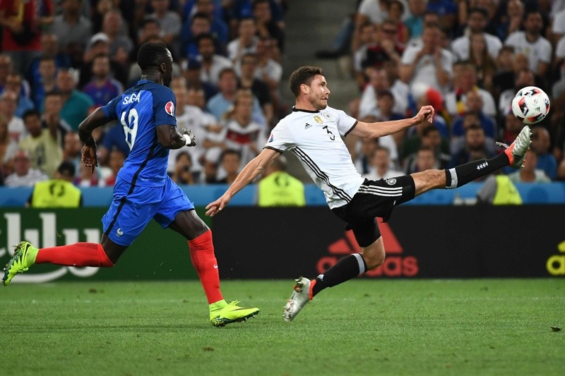 Germany's defender Jonas Hector (R) vies for the ball with France's defender Bacary Sagna during the Euro 2016 semi-final football match between Germany and France at the Stade Velodrome in Marseille on July 7, 2016.  AFP Photo