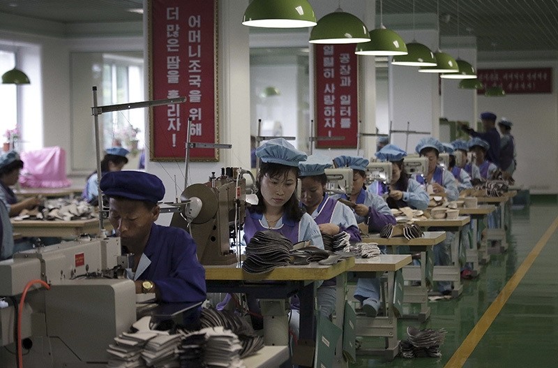 Factory workers operate sewing machines at a shoe factory in Wonsan, North Korea. (AP Photo)