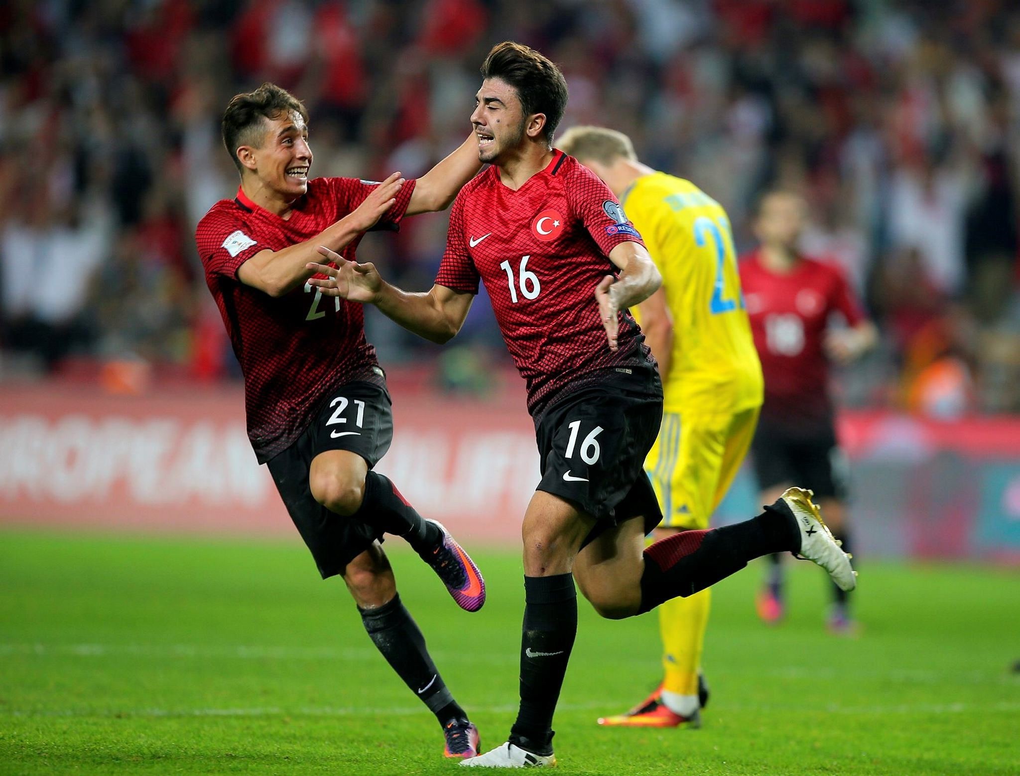 Turkey's Ozan Tufan, right, celebrates after scoring, as his teammate Emre Mor runs to join him, during the World Cup Group I qualifying match between Turkey and Ukraine. (AP Photo)