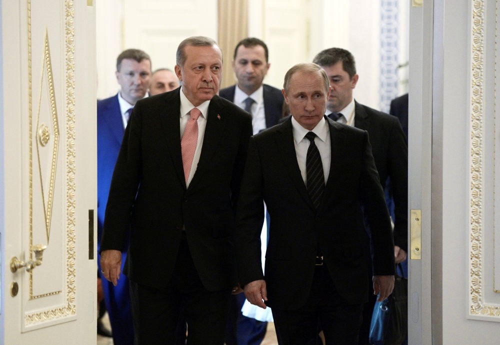 Turkish President Tayyip Erdou011fan (L) and Russian President Vladimir Putin attend a press conference following their meeting in St. Petersburg yesterday.