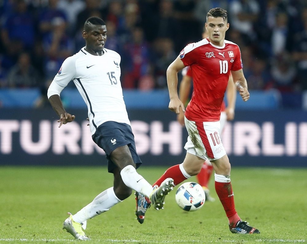 Pogbau2019s (L) potential 160 million pound price tag will end up closer to 145 million pounds rather than the  pre-referendum number of 113 million pound.