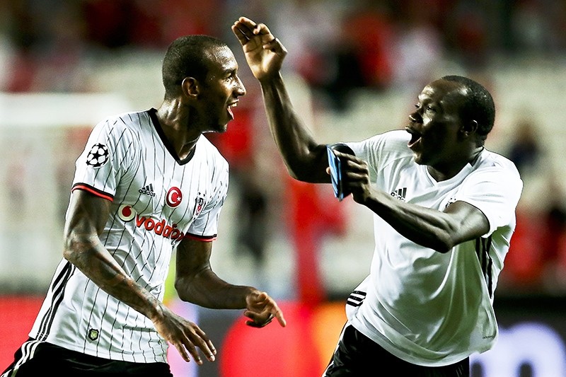 alisca (L) celebrates with his teammate Vincent Aboubakar (R) after scoring the 1-1 equalizer during the UEFA Champions League group B soccer match between Benfica Lisbon and Beu015fiktau015f. (EPA Photo)