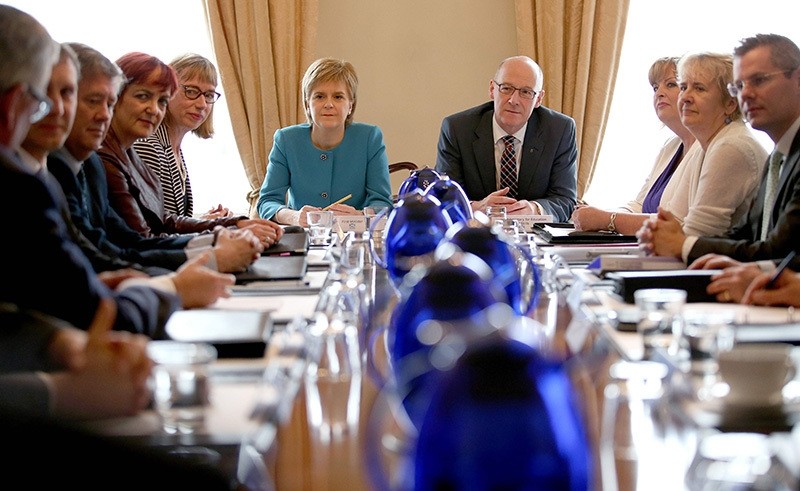 Scotland's First Minister and Leader of the Scottish National Party (SNP), Nicola Sturgeon (6L), chairs an emergency Cabinet meeting at Bute House in Edinburgh, Scotland, following the pro-Brexit result of the UK's EU referendum vote. (AFP Photo)