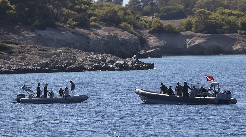 Greek authorities search an area between Aegina and the small deserted islet of Moni, southwest of Athens, Tuesday, Aug. 16, 2016 (AP Photo)