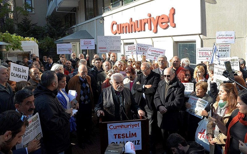 Protestors reading out statements in front of Cumhuriyet daily's building in u015eiu015fli, u0130stanbul (DHA Photo)