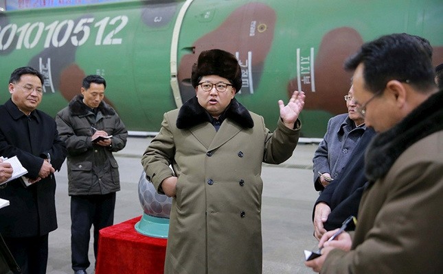 North Korean leader Kim Jong Un meets scientists and technicians in the field of research into nuclear weapons in this undated photo released by North Korea's Korean Central News Agency (KCNA) in Pyongyang, March 9, 2016. (Reuters Photo)