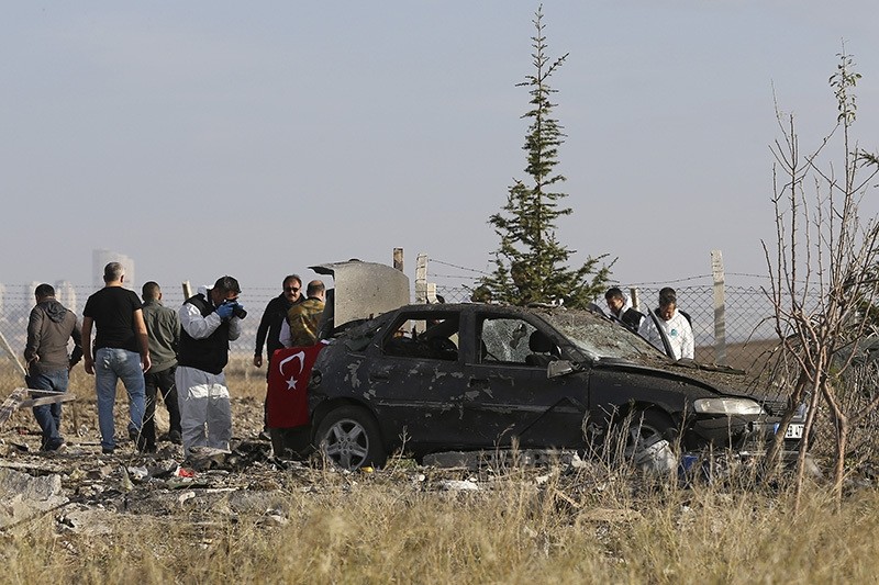 Police investigating the vehicle in which two terrorists blew themselves up outside a horse farm in Ankara's Haymana district on October 8, 2016 (AA Photo)