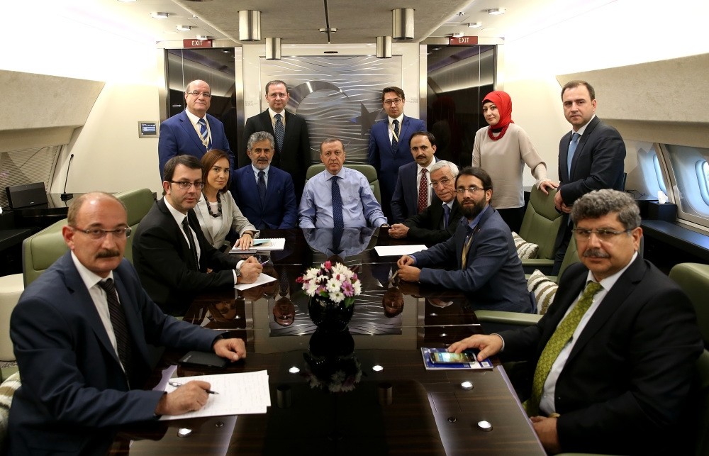President Erdou011fan on the Presidential Plane with journalists, including Daily Sabah Editor-in-Chief Serdar Karagu00f6z (center-back), on his return flight from the NATO summit.
