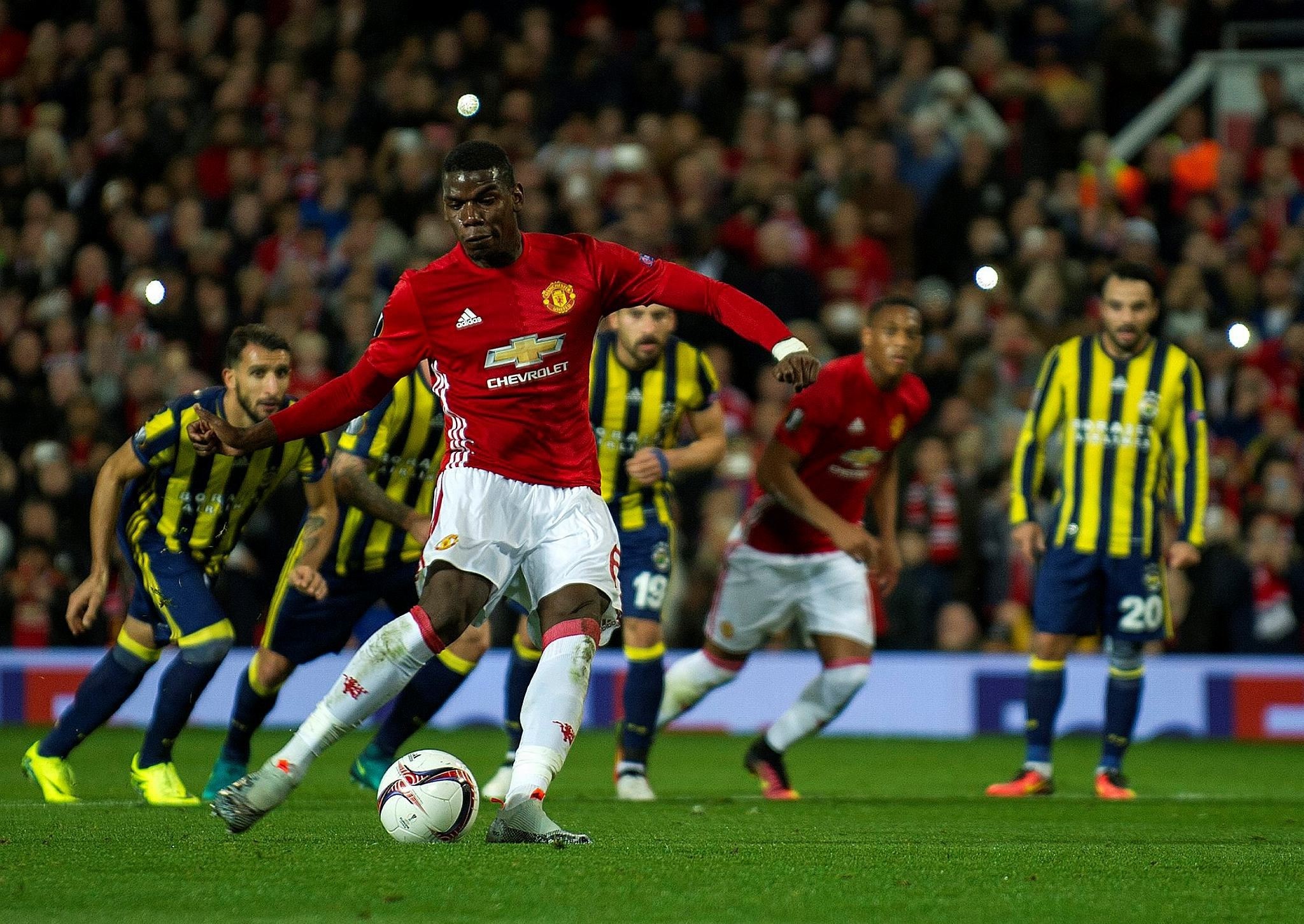 Manchester United's Paul Pogba scores the opening goal during the UEFA Europa League group A match between Manchester United and Fenerbahce. (Reuters Photo)