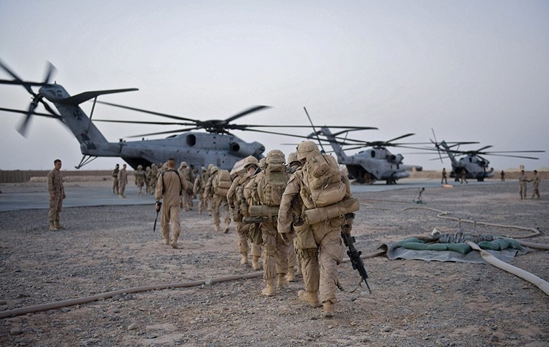 US Marines from the 2nd Battalion, 8th Marine Regiment of the 2nd Marine Expeditionary Brigade walk towards the helicopter as part of Operation Khanjar at Camp Dwyer in Helmand Province in Afghanistan on July 2, 2009. (AFP Photo)