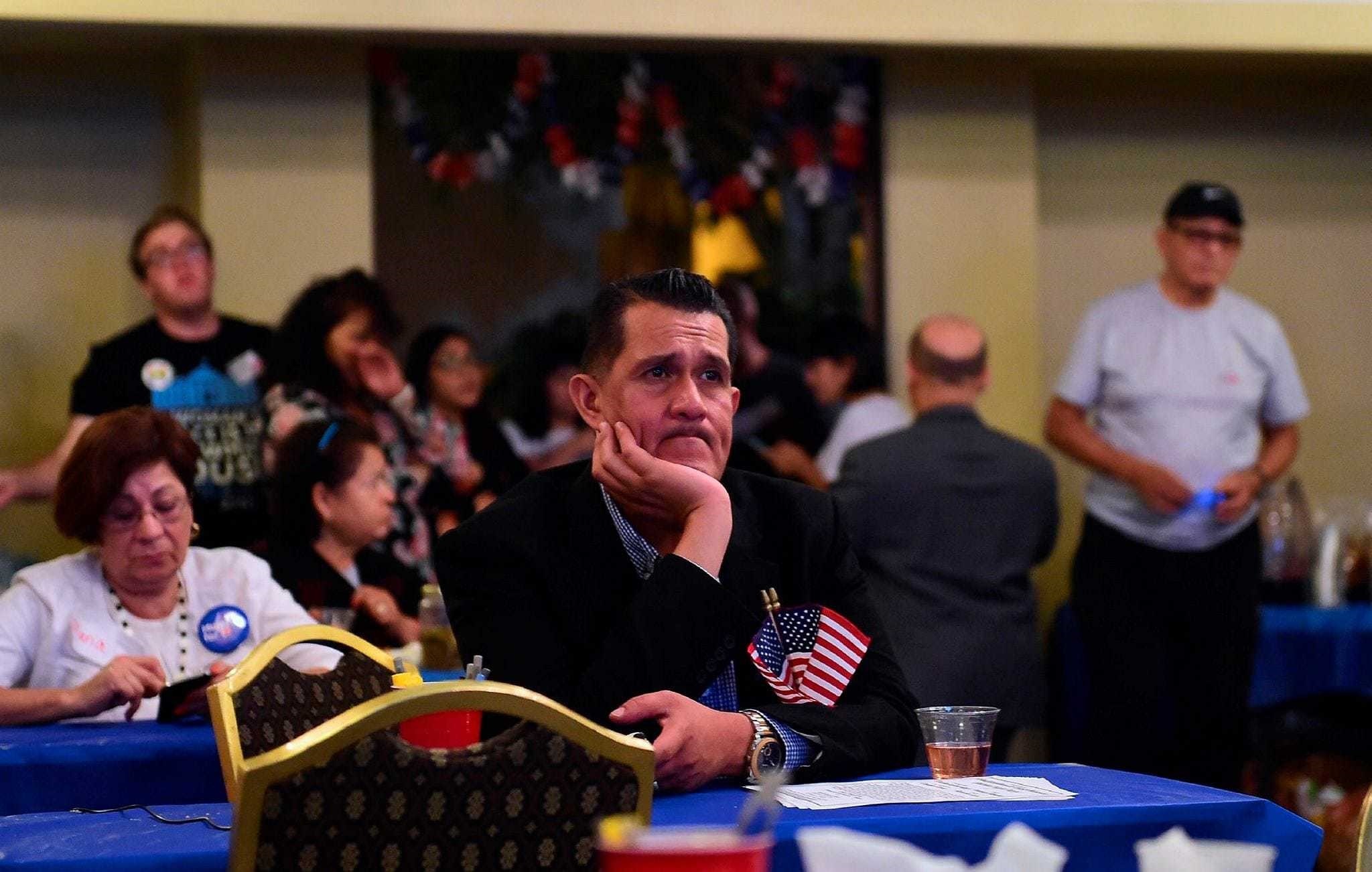 People watch the election results from the headquarters of U.S. Democratic presidential candidate Hillary Clinton in East Los Angeles, California, Nov. 8.