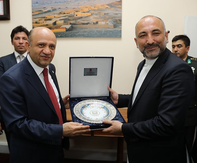 Turkish defense minister Fikri Iu015fu0131k (L), National Security Advisor to Ashraf Ghani the President of Afghanistan, Hanif Atmar (R) in Kabul (AA photo)