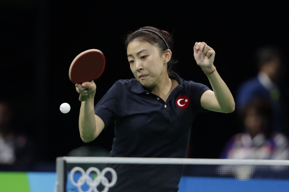 Chinese-born Turkish player Melek Hu plays against Chen Szu-Yu of Taiwan during their table tennis match at the 2016 Summer Olympics in Rio de Janeiro.