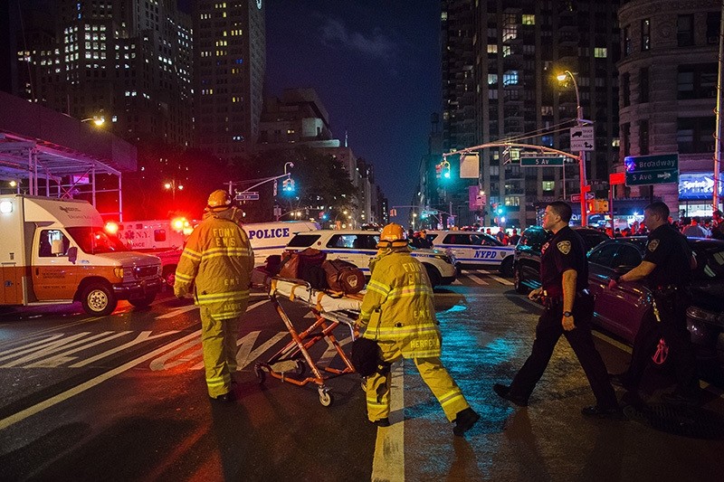Police and firefighters work near the scene of an explosion in Manhattan's Chelsea neighborhood, in New York, injured 29, Sept. 17, 2016. (AP Photo)