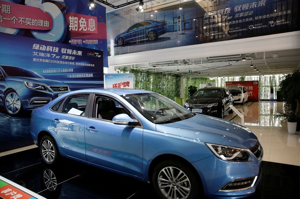 Automobiles are displayed at a electric car dealership in Shanghai.