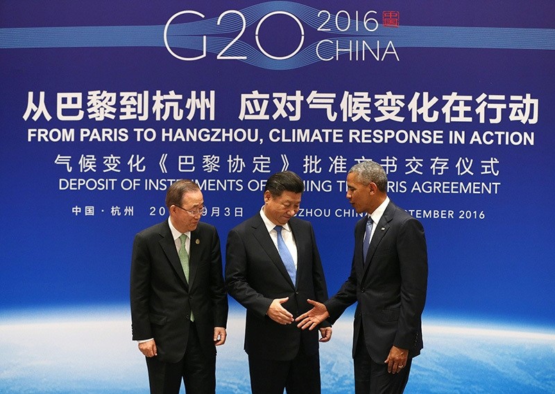 China's Xi Jinping (C), US President Barack Obama (R) and UN Secretary General Ban Ki-moon shake hands during a joint ratification of the Paris climate change agreement ceremony at West Lake State Guest House in Hangzhou on Sept 3, 2016. (AFP Photo)