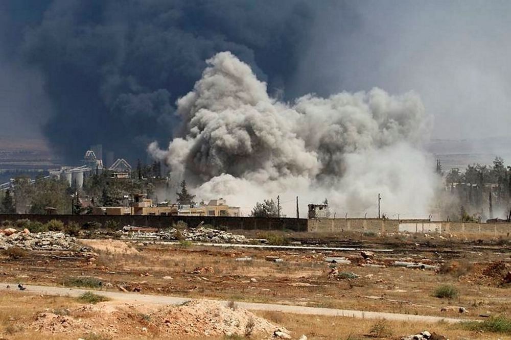 Smoke billows following airstrikes by Assad forces on opposition positions during intense fighting in Aleppo.