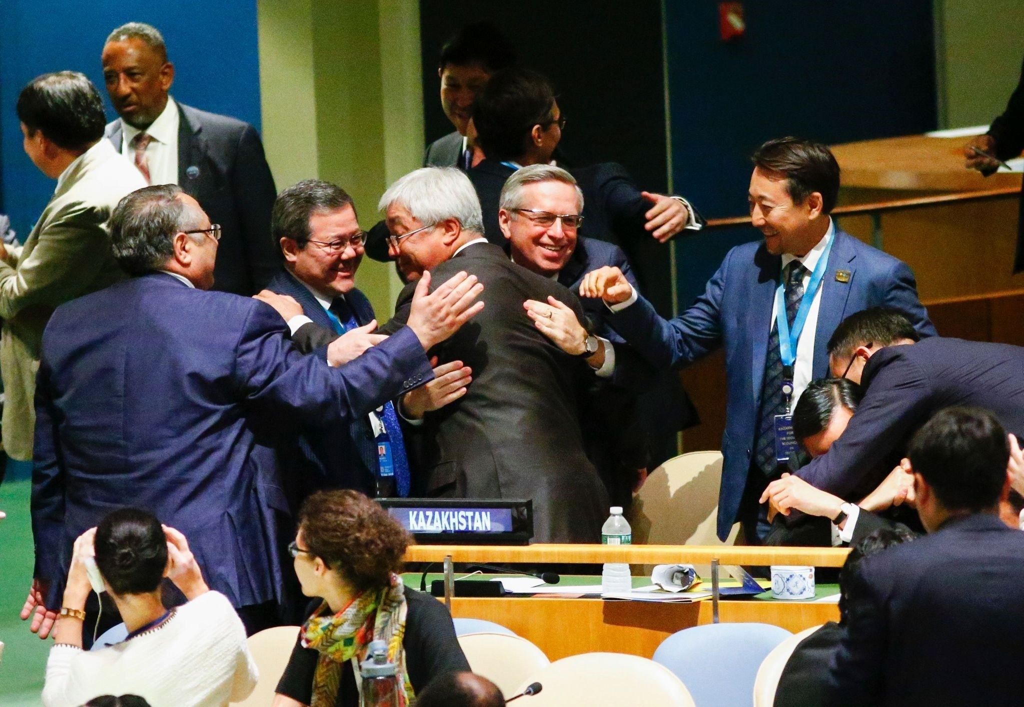 Kazakhstan's FM Erlan Idrissov (C) reacts after Kazakhstan won a seat during the Election of five non-permanent members of the Security Council at the United Nations in New York on June 28 2016. (AFP Photo)