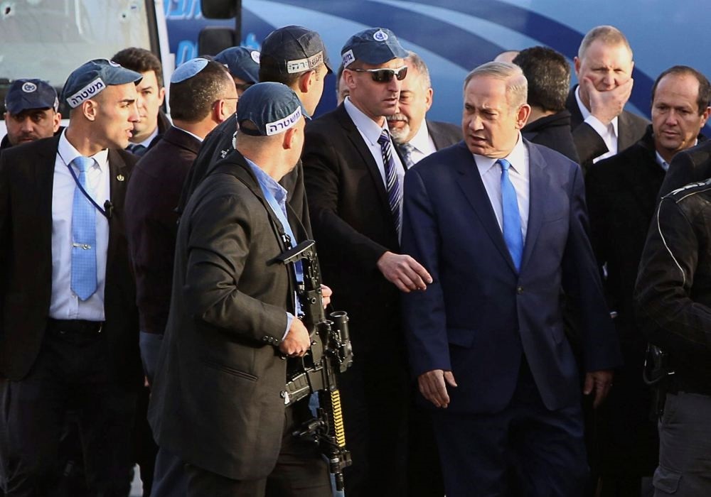 Israeli Prime Minister Benjamin Netanyahu visits the site where a Palestinian driver rammed a truck into a group of Israeli soldiers in Jerusalem on Jan. 8.