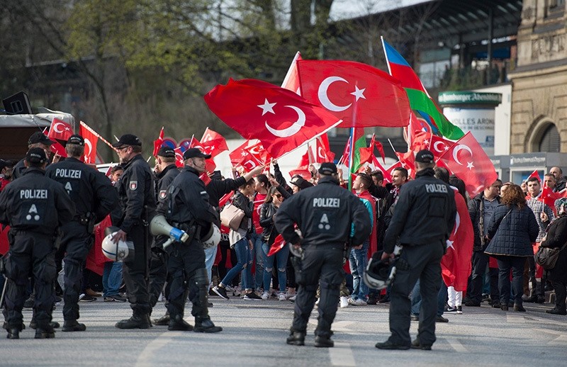 This file photo taken on April 10, 2016 shows Police cordoning protesters during a ,Peace March for Turkey, organized by the new German Turkish Committee in Hamburg. (AFP Photo)