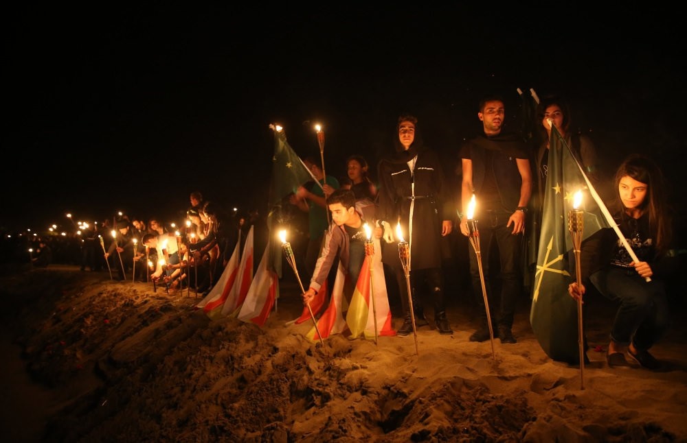 Circassian community members light fires on the beach of a village in Kocaeli in the northwest, one of the first places they settled in Turkey after the exile, to remember the anniversary of the exile.