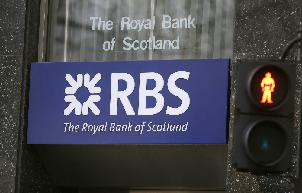 The Royal Bank of Scotland reported a pretax operating loss of 695 million pounds in the second quarter. (AP Photo)