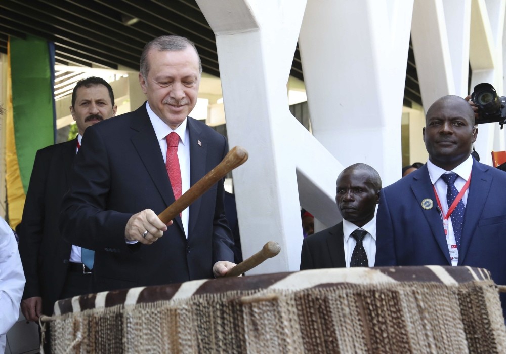 Turkish President, Recep Tayyip Erdou011fan, beats a traditional drum during the official welcoming ceremony at State House in Dar es Salaam Tanzania.